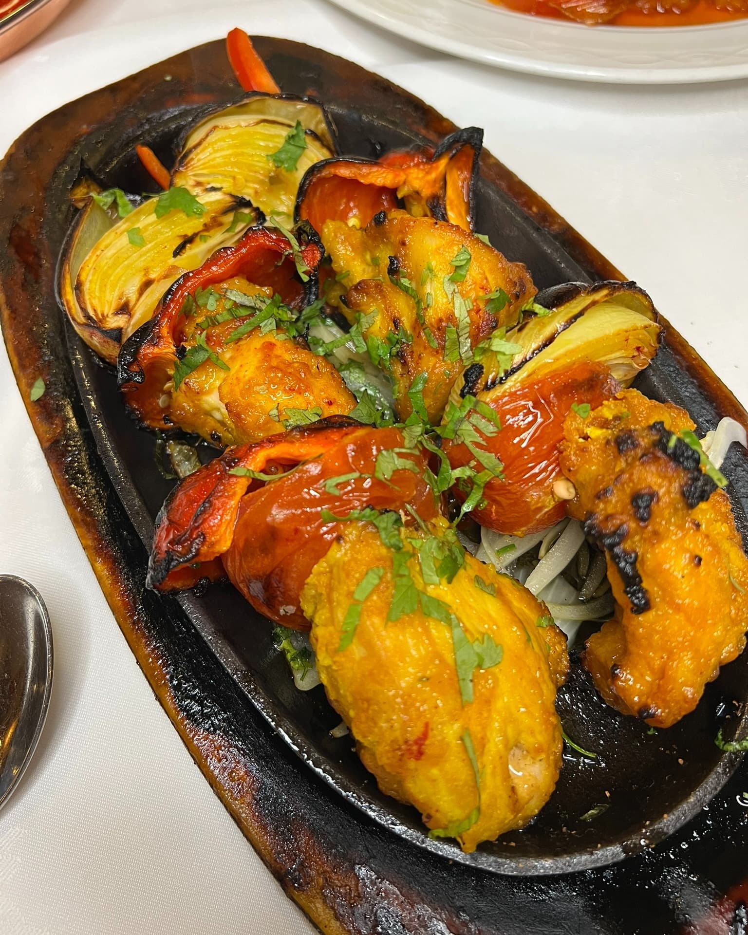 Tandoori sizzler with peppers and onions
